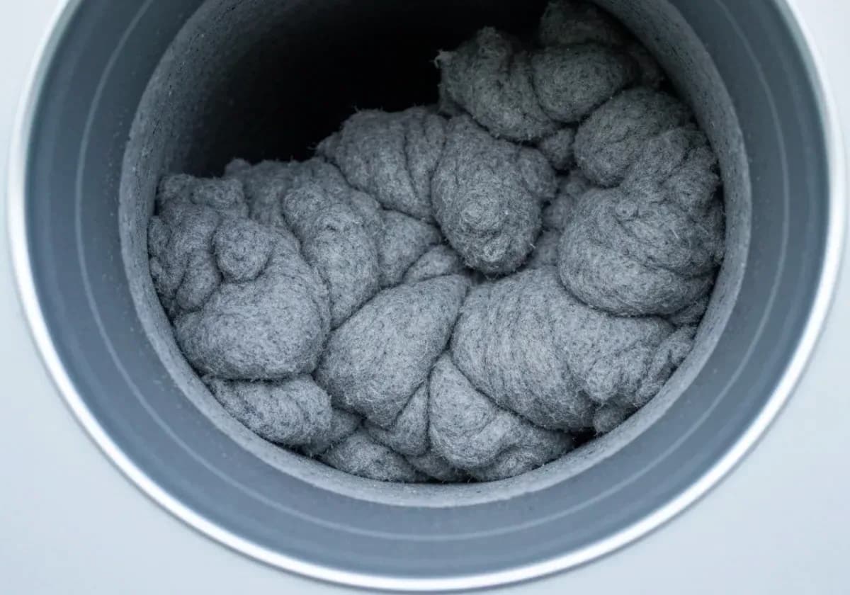 Before — dryer vent cleaning: A lint-packed vent run cleared end to end for a cooler, faster dryer.